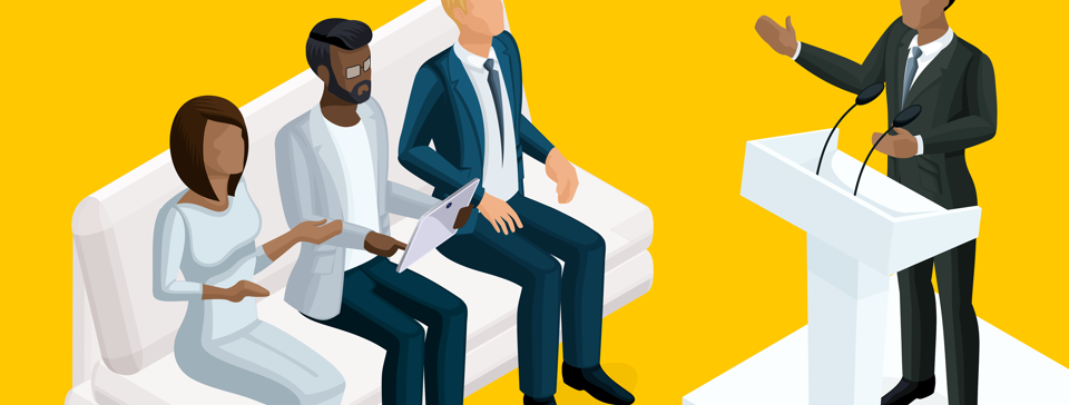 people sitting on couch with a speaker