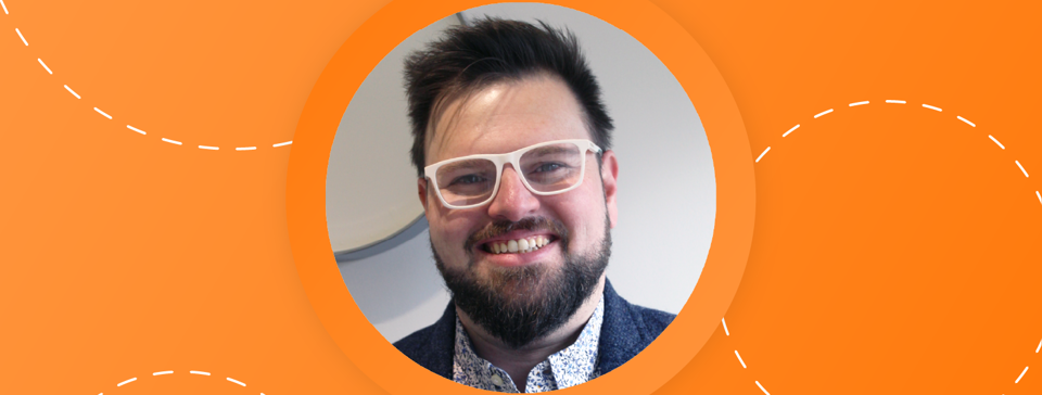 Chris Mullan, Head of Data & AI, on orange background